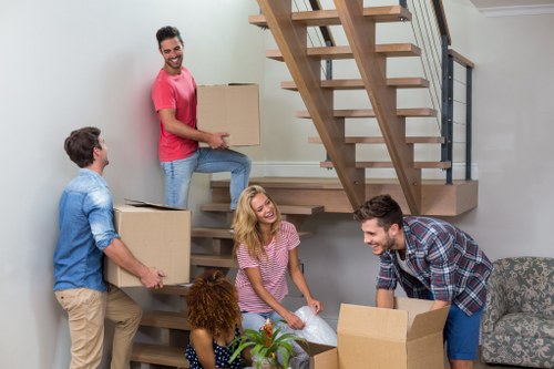 Loading furniture into a moving truck for an East London move