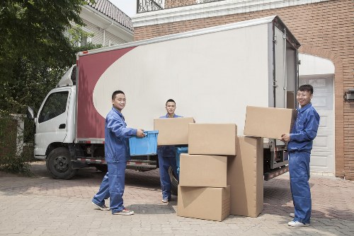 Furniture collection service removing a sofa from a London flat