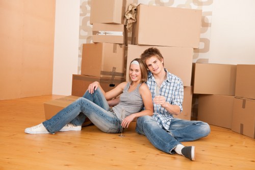 Removal van and moving team preparing a house move in East London