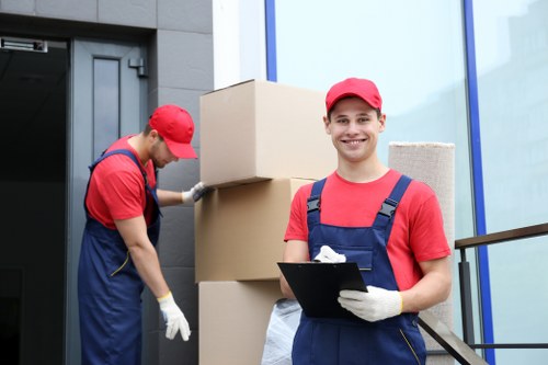 Prepared moving boxes and furniture inside an East London property