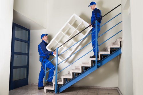 Professional movers loading furniture for a local East London move