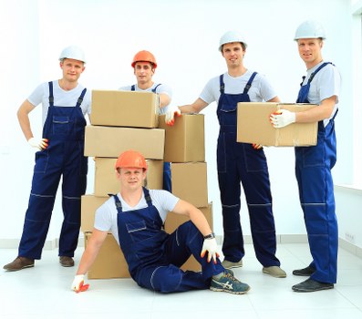 Removal team handling a flat move in a busy East London street