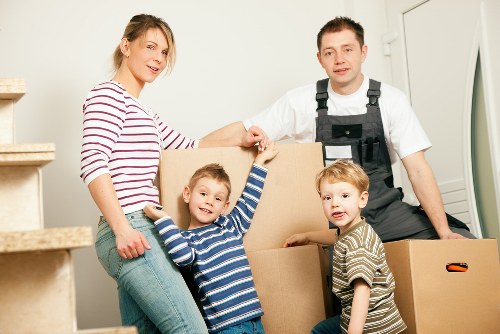 Team using safe lifting techniques while moving boxes