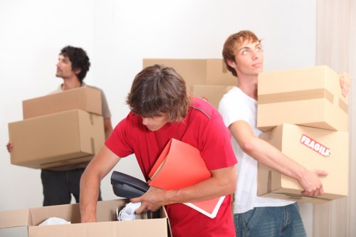 Packed boxes and furniture ready for transport in an East London property