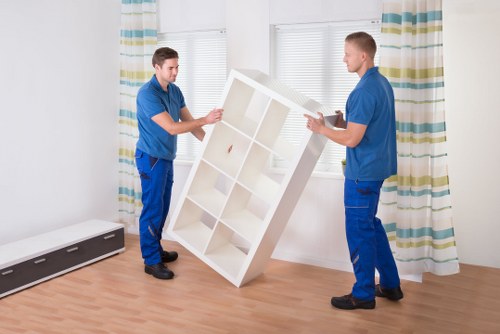 Careful loading of household furniture into a moving vehicle