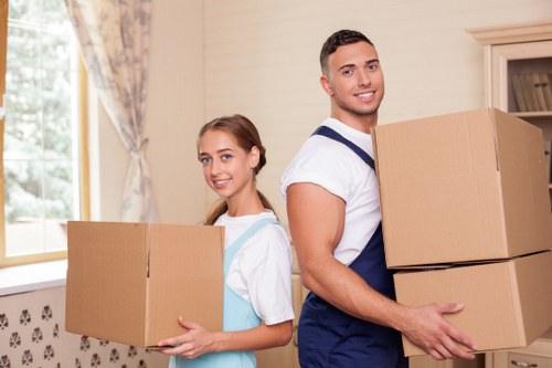 Professional movers preparing a careful household relocation in East London