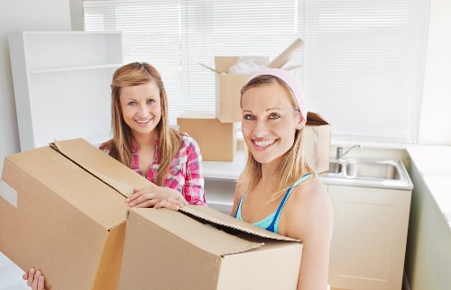 Team loading bulky household furniture for pick-up