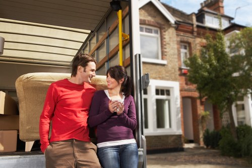Packed moving boxes and furniture ready for transport in East London