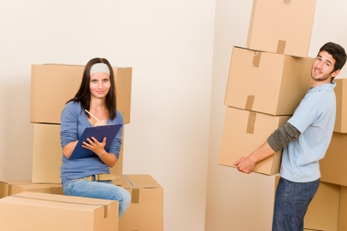 Professional movers handling a flat move with stairs in East London