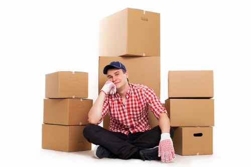 Removal team carrying furniture through an apartment building