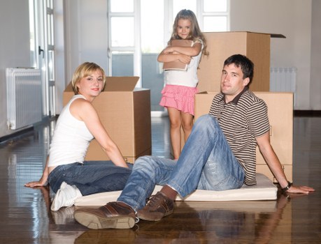 Removals crew handling items carefully during transport